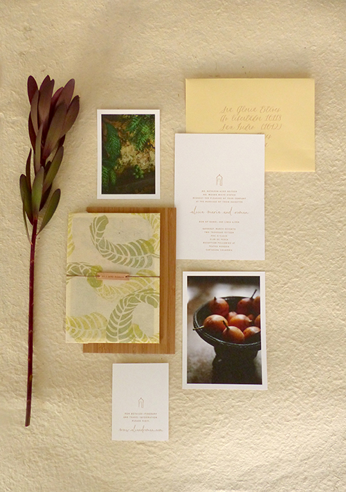 Invitation for Cartagena, Columbia wedding with hand stamped banana leaves on lokta paper with leather name tag by Shindig Bespoke