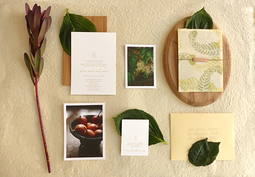 Invitation for Cartagena, Columbia wedding with hand stamped banana leaves on lokta paper with leather name tag by Shindig Bespoke
