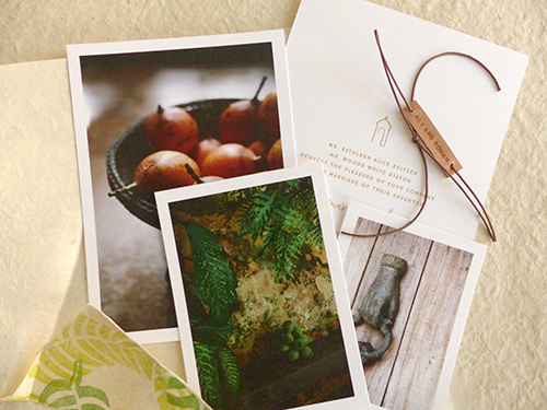 Invitation for Cartagena, Columbia wedding with hand stamped banana leaves on lokta paper with leather name tag by Shindig Bespoke