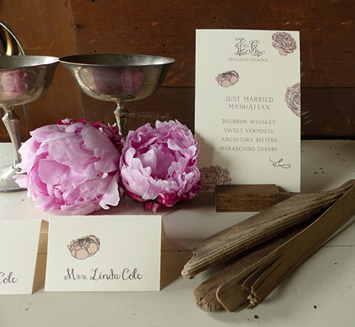 Signature cocktail bar sign and place cards with pink peonies by Shindig Bespoke.